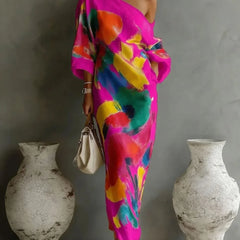 One-shoulder maxi dress in magenta with multicolor abstract paint pattern, draped sleeves