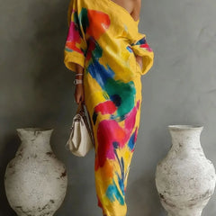 One-shoulder maxi dress in yellow with multicolor abstract paint pattern, draped sleeves