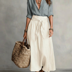 Two-piece set: light blue blouse and cream midi skirt with tie waist