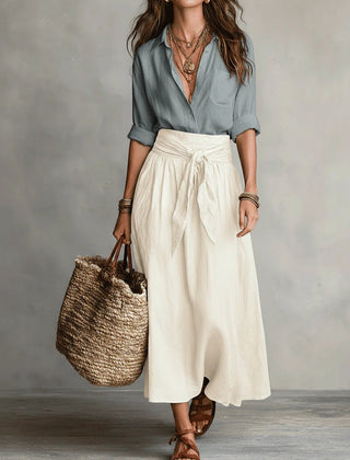 Two-piece set: light blue blouse and cream midi skirt with tie waist