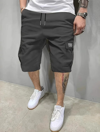 Dark charcoal utility shorts with drawstring waist and side cargo pockets