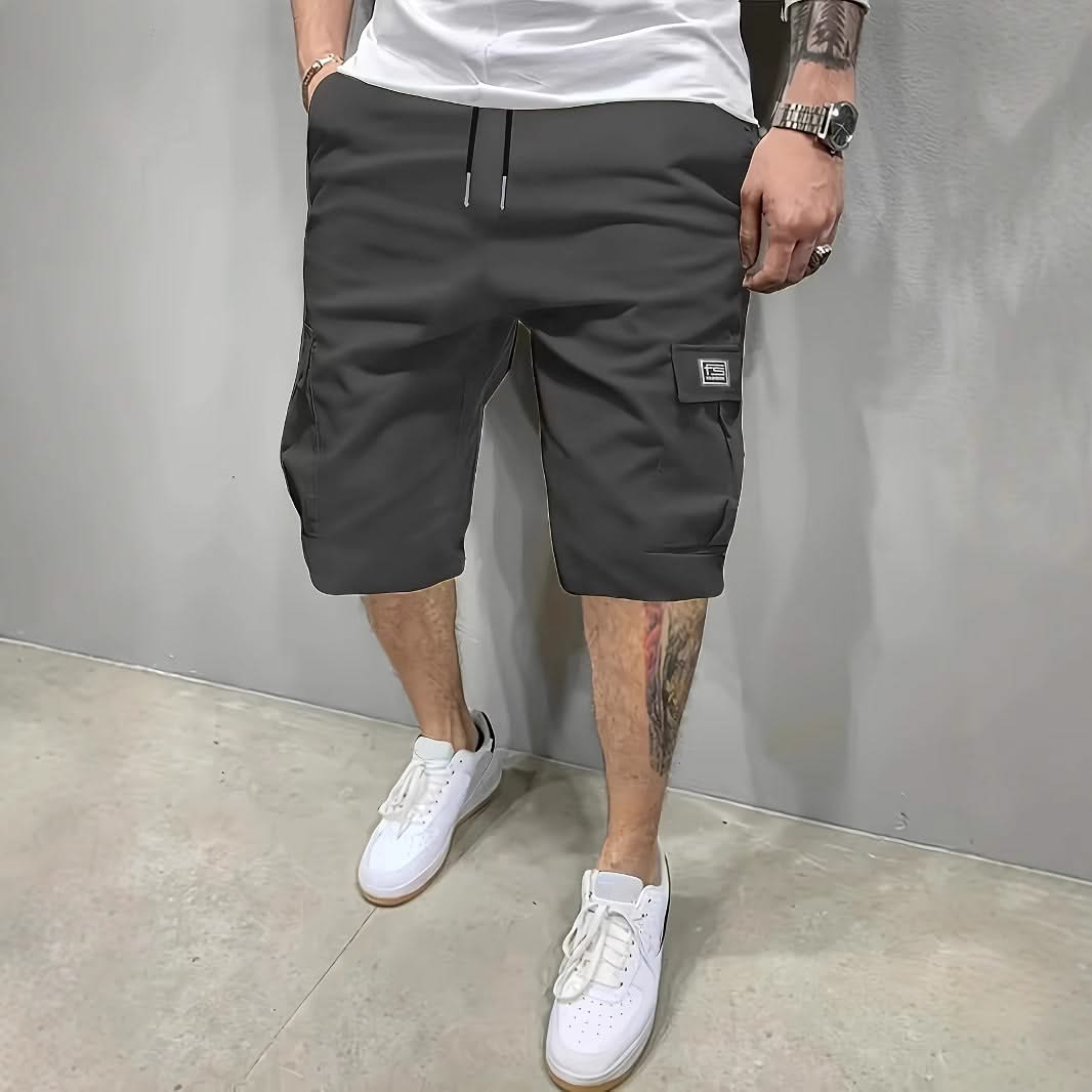 Dark charcoal utility shorts with drawstring waist and side cargo pockets