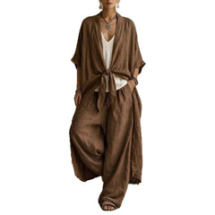 Brown oversized linen kimono and wide-leg pants set with front tie, airy linen texture.