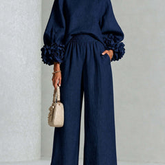 Navy two-piece set: long-sleeve blouse and wide-leg pants with floral puff cuff sleeves