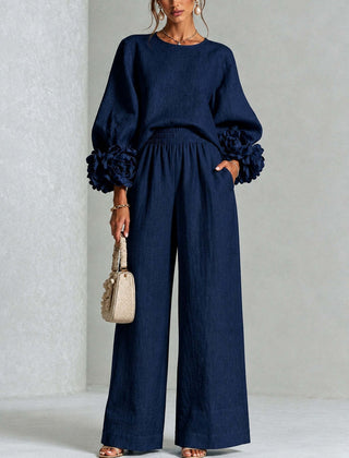 Navy two-piece set: long-sleeve blouse and wide-leg pants with floral puff cuff sleeves