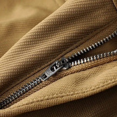 Khaki premium pants close-up of zip fly and textured waistband fabric