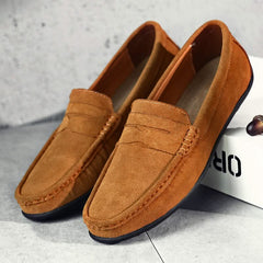 Suede loafers in tan with slip-on strap detail, moc stitching, and dark sole