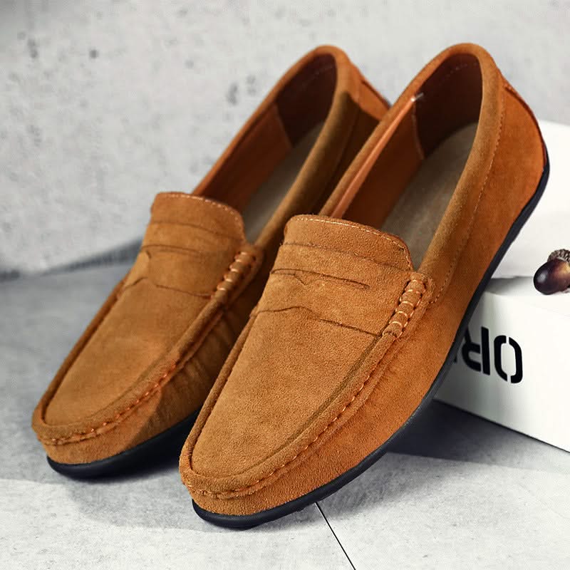 Suede loafers in tan with slip-on strap detail, moc stitching, and dark sole