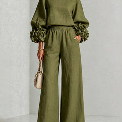 Green two-piece set: long-sleeve blouse and wide-leg pants with floral puff cuff sleeves
