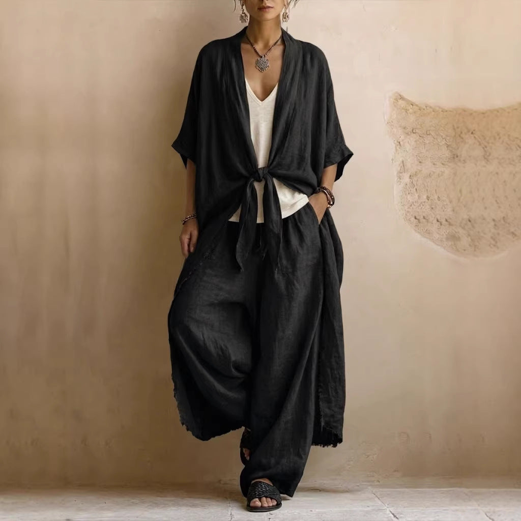 Black oversized linen kimono set with tied front and wide-leg pants, loose flowing drape.