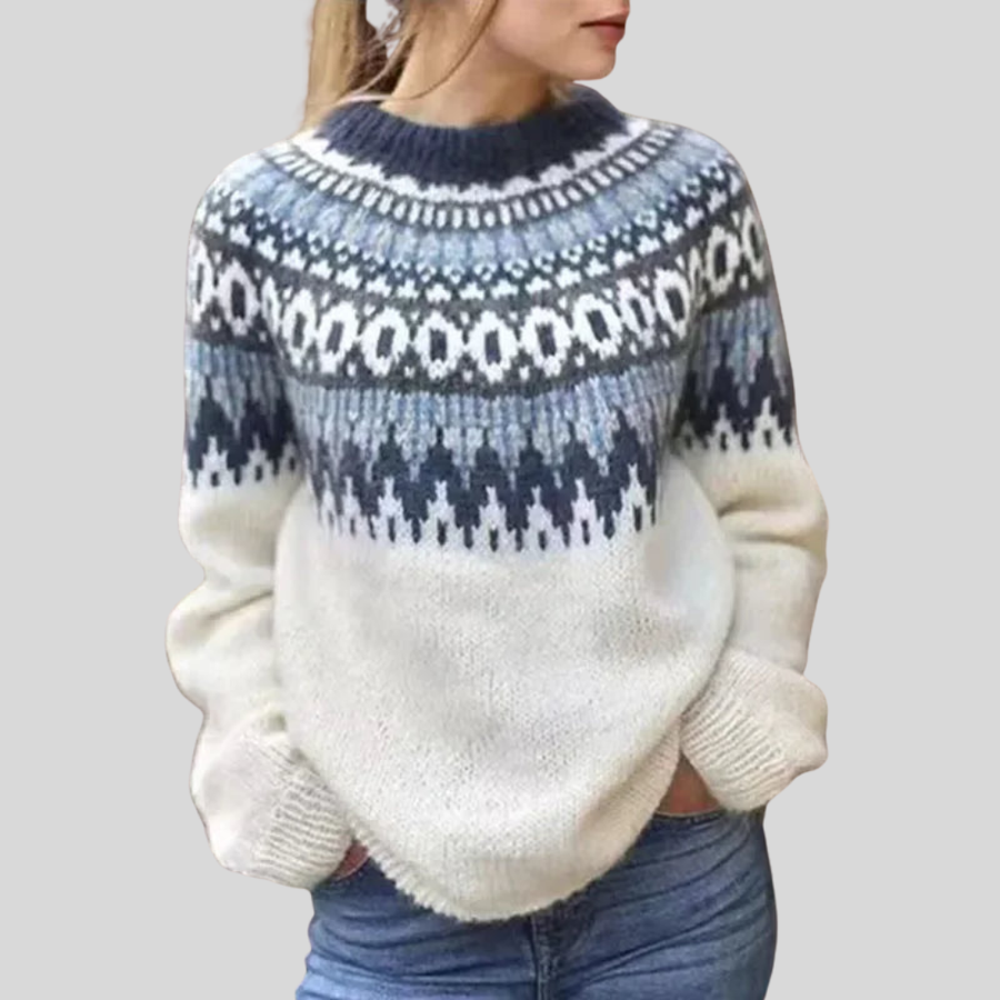 Cream knit sweater with navy fair-isle yoke, crew neck, and ribbed cuffs and hem