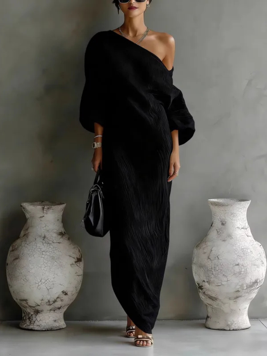 Black one-shoulder maxi dress with draped wrap bodice and long column skirt