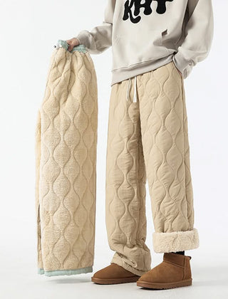 Beige quilted drawstring pants with elastic waist and sherpa-lined cuffs.