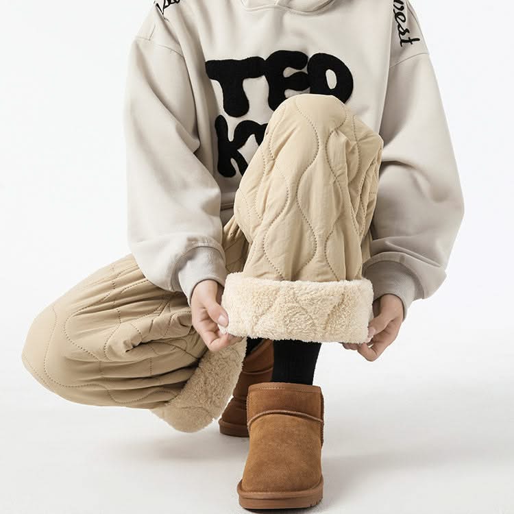 Beige quilted pants, sherpa-lined cuffs and drawstring waist detail.