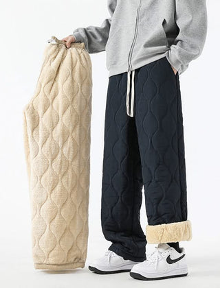 Dark quilted drawstring pants with elastic waist and sherpa-lined cuffs.