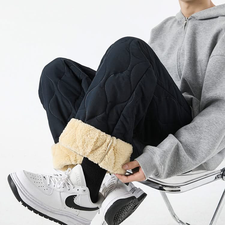 Dark navy quilted pants with sherpa-lined cuffs and relaxed drape, drawstring waist.