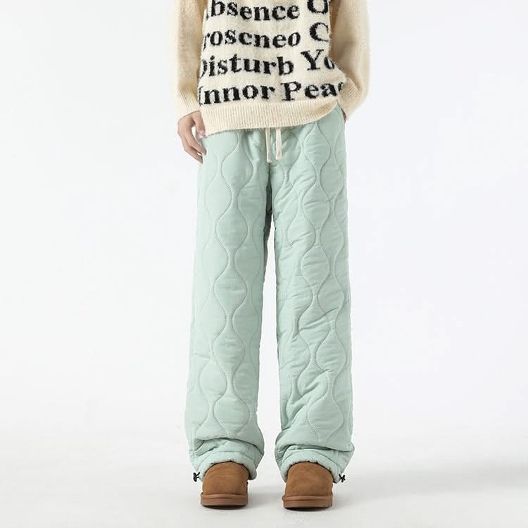 Mint-green quilted pants with elastic waist, drawstring, and sherpa-lined cuffs.
