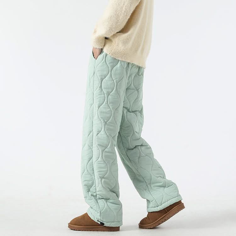 Mint green quilted pants with raised oval pattern and ankle cuffs, drawstring.