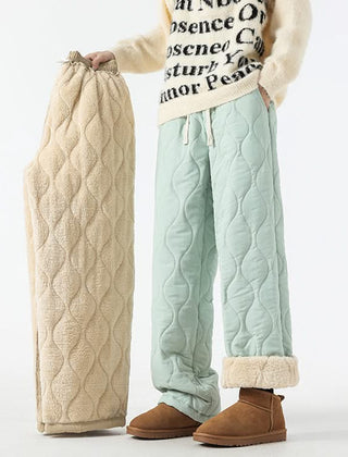 Mint-green quilted drawstring pants with elastic waist and sherpa-lined cuffs.