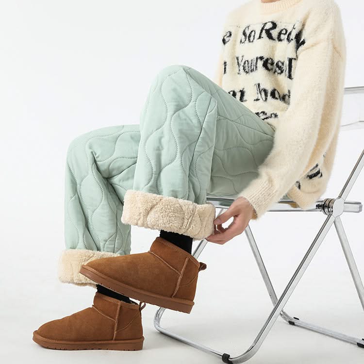 Seafoam quilted pants with raised oval pattern and sherpa-lined cuffs, drawstring waist.