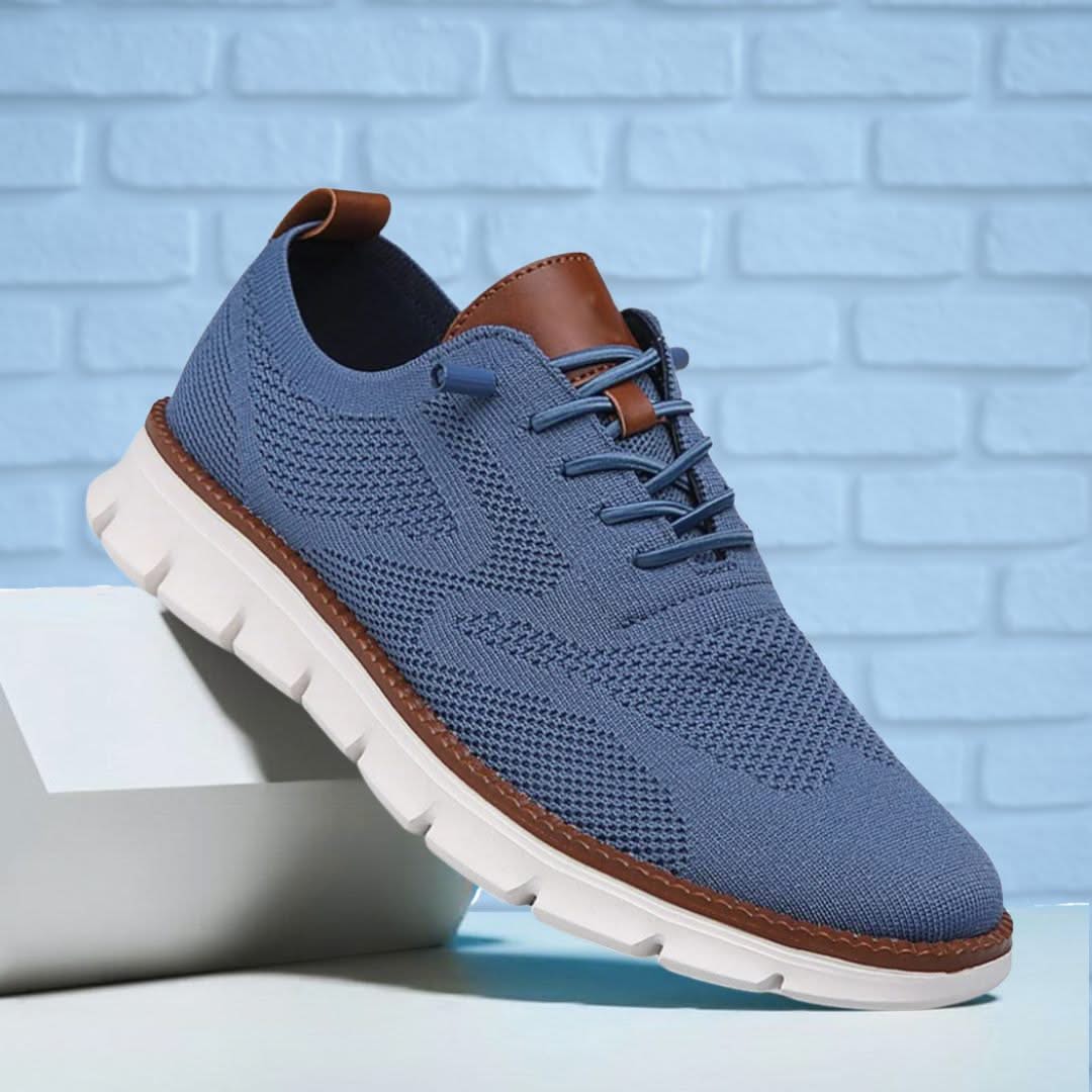 Blue knit lace-up walking shoes with brown heel tab and white cushioned outsole