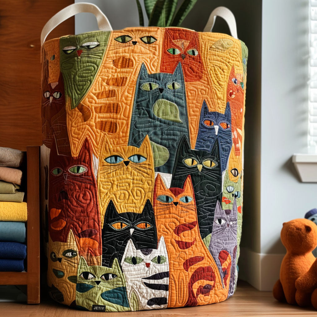 Quilted fabric laundry basket with orange cat face pattern and two carry handles