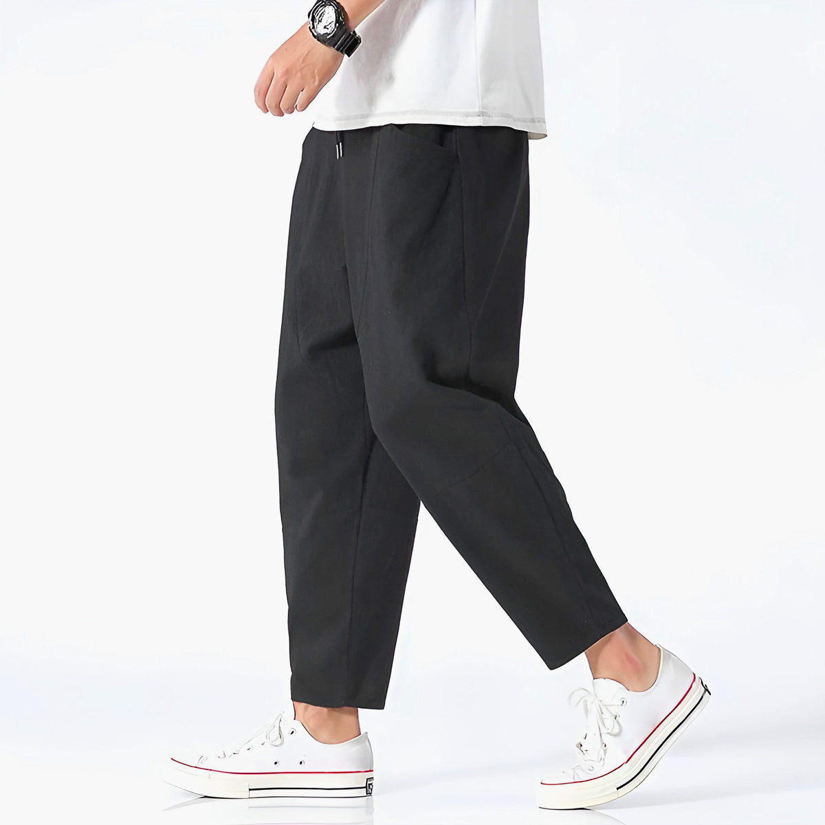 Black cropped cotton pants with drawstring waist and relaxed straight legs