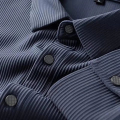 Blue business shirt close-up, ribbed texture with dark buttons along the placket