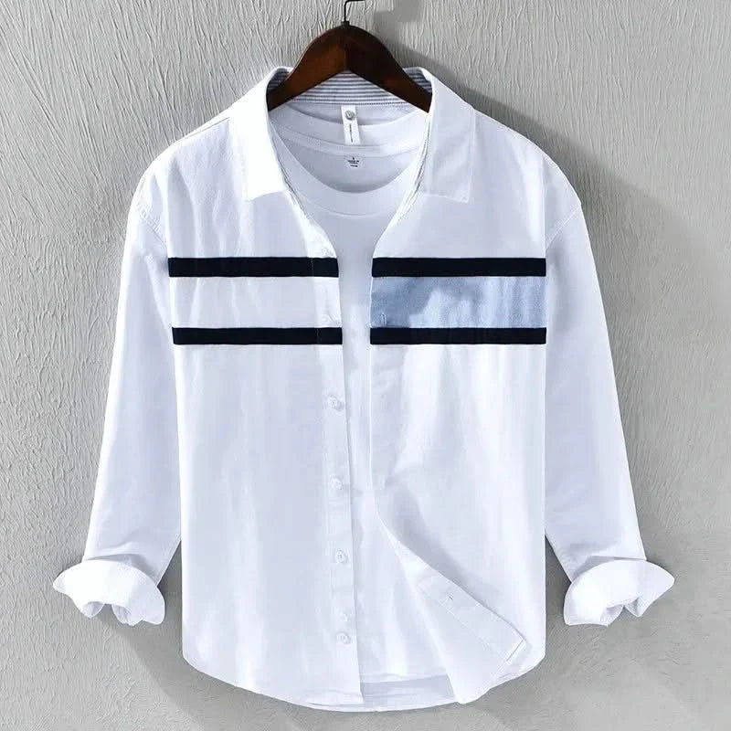 White panel button-up shirt with dark stripe band across chest, long sleeves, button front