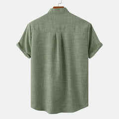 Back view of short-sleeve button-up shirt in olive green, simple yoke seam