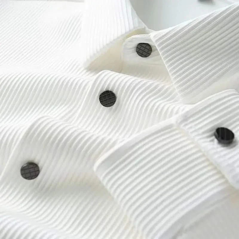 White business shirt front, close-up of textured fabric and black button details