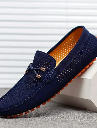 Navy perforated leather loafer with metal bar detail and moccasin stitching