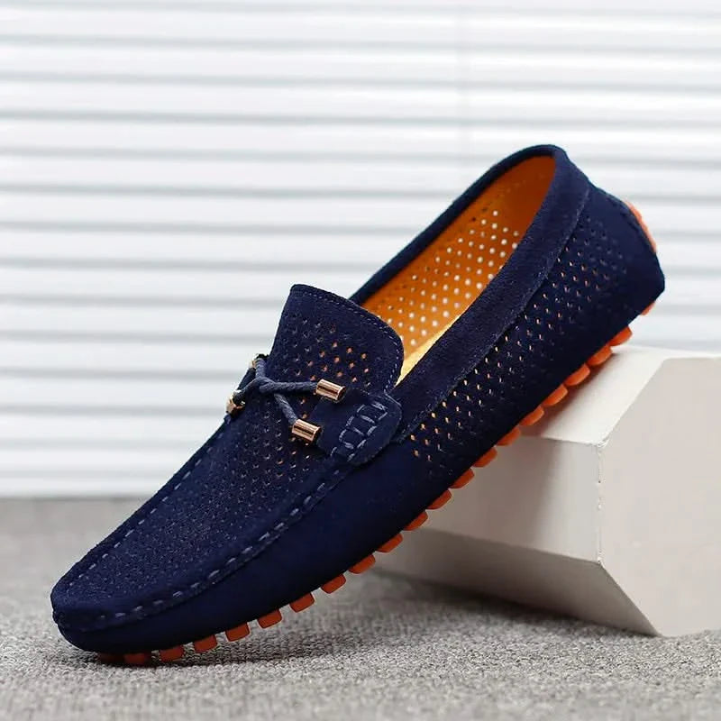 Navy perforated leather loafer with metal bar detail and moccasin stitching