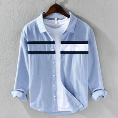 Light blue panel button-up shirt with white chest panels and dark stripe bands, button front