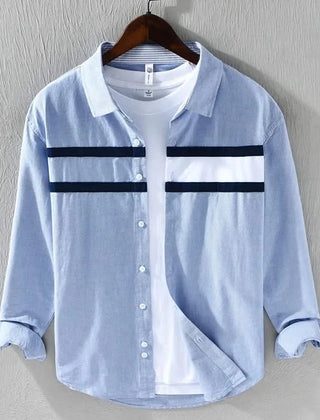 Light blue panel button-up shirt with white chest panels and dark stripe bands, button front