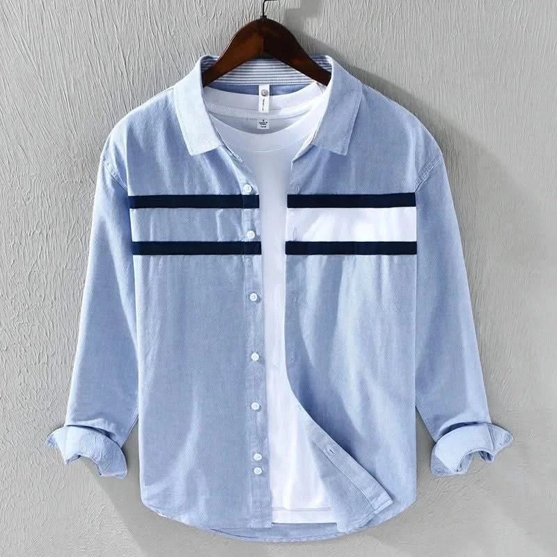 Light blue panel button-up shirt with white chest panels and dark stripe bands, button front