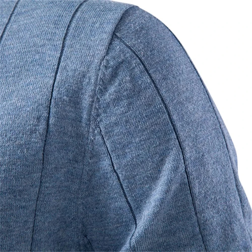 Blue tee fabric close-up of side panel seam and curved sleeve stitching