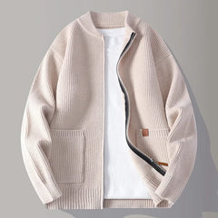 Beige rib knit zip-up jacket with stand collar, front pockets, and tan logo patch
