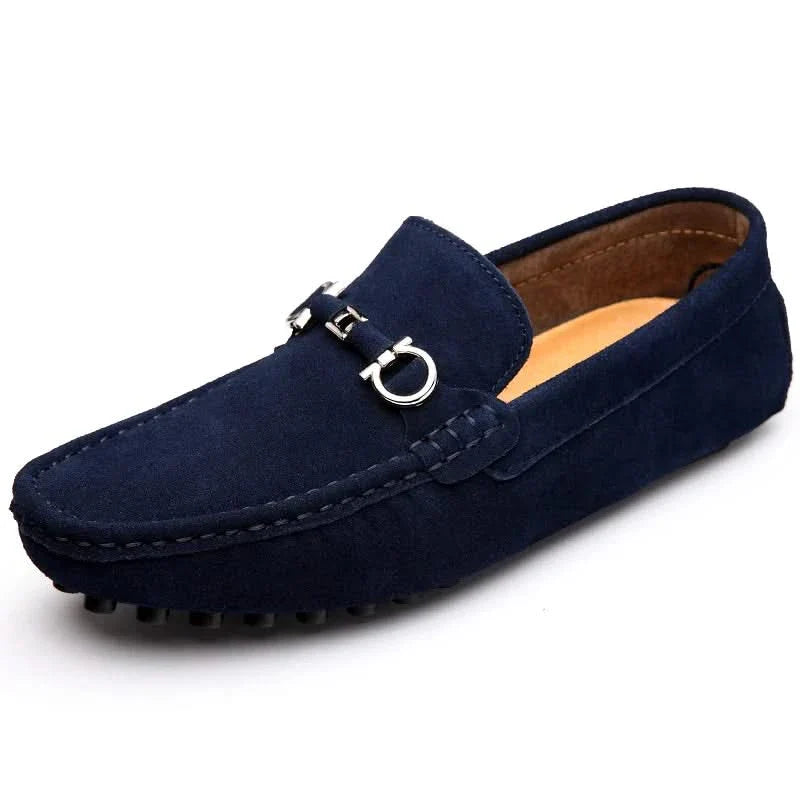 Navy suede loafers with silver buckle ornament and textured rubber outsole
