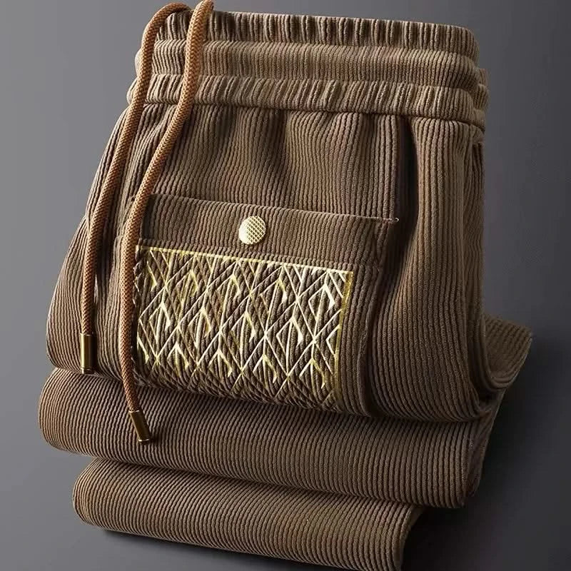 Tan/brown ribbed cotton pants with elastic waist and drawstring, front patterned pocket
