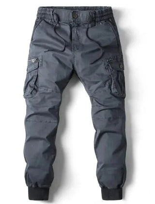 Dark grey cargo pants with drawstring waist, button fly, and side cargo pockets