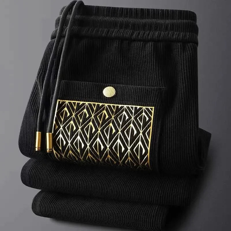Black ribbed cotton pants, elastic waistband, drawstring, patterned front pocket
