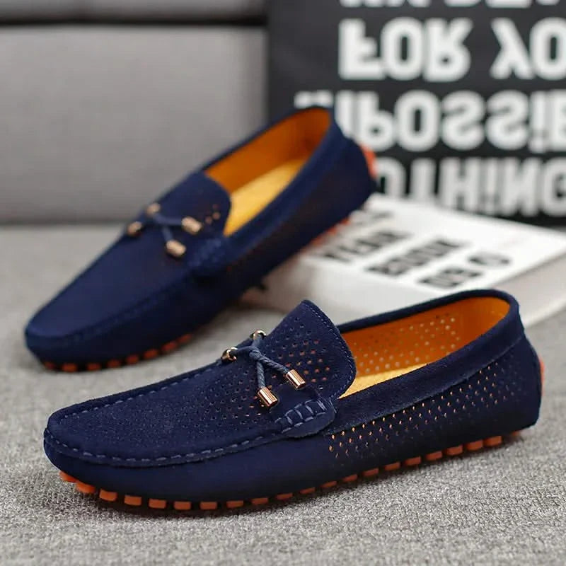 Navy perforated leather loafer with metal bar detail and orange tread