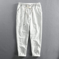 White striped linen pants with elastic waistband, drawstring tie, relaxed ankle length