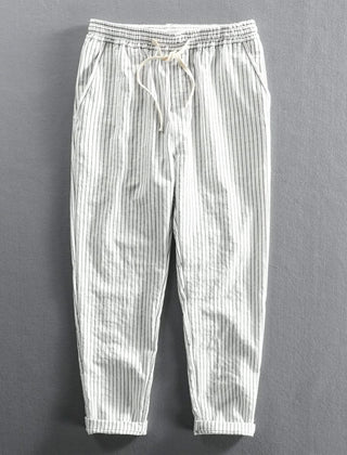 White striped linen pants with elastic waistband, drawstring tie, relaxed ankle length