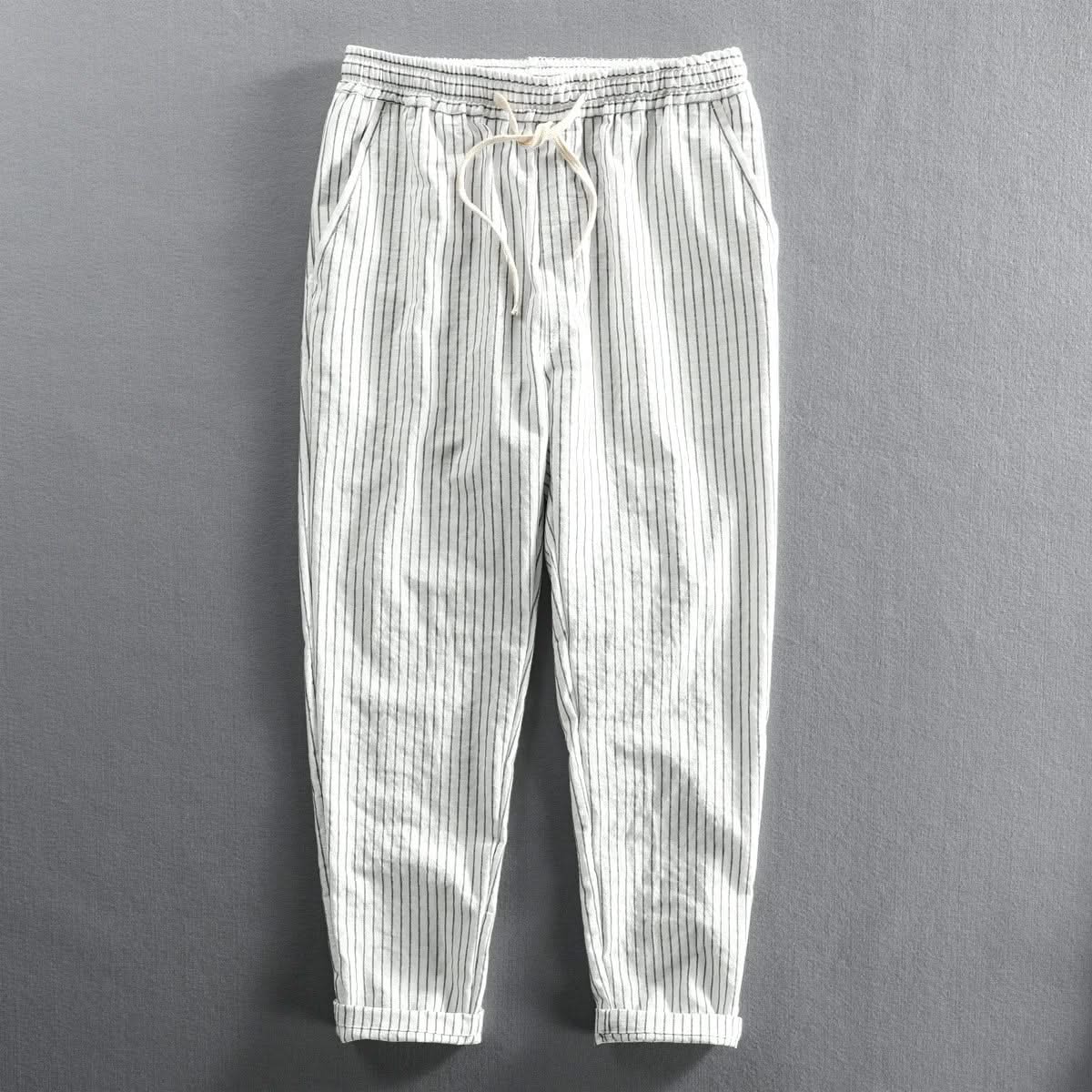 White striped linen pants with elastic waistband, drawstring tie, relaxed ankle length