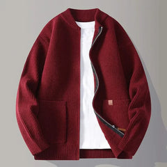 Red rib knit zip-up jacket with stand collar, front pockets, and tan logo patch