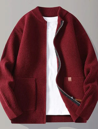 Red rib knit zip-up jacket with stand collar, front pockets, and tan logo patch