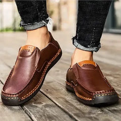 Burgundy-brown leather slip-on loafer pair with contrast stitching and bit detail