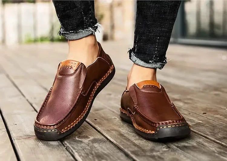 Burgundy-brown leather slip-on loafer pair with contrast stitching and bit detail